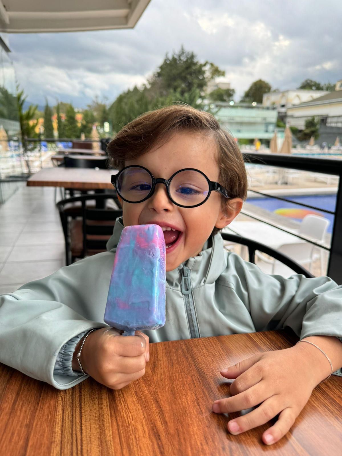 Young customer enjoying a colorful frozen bar