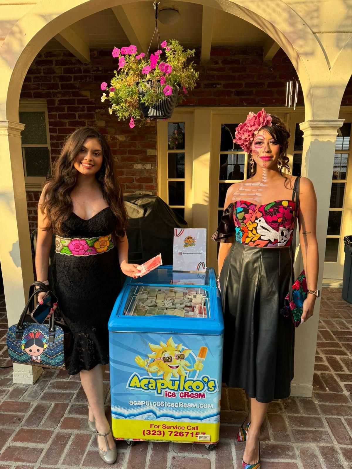 Customers with an Acapulco's branded freezer at a community event